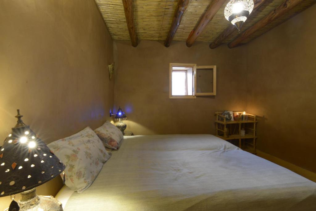 Postel nebo postele na pokoji v ubytování Guest farm Oulad Chmicha