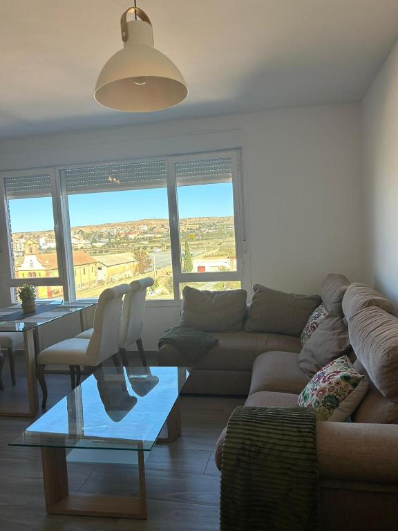 a living room with a couch and a table at La Azucarera in Guadix