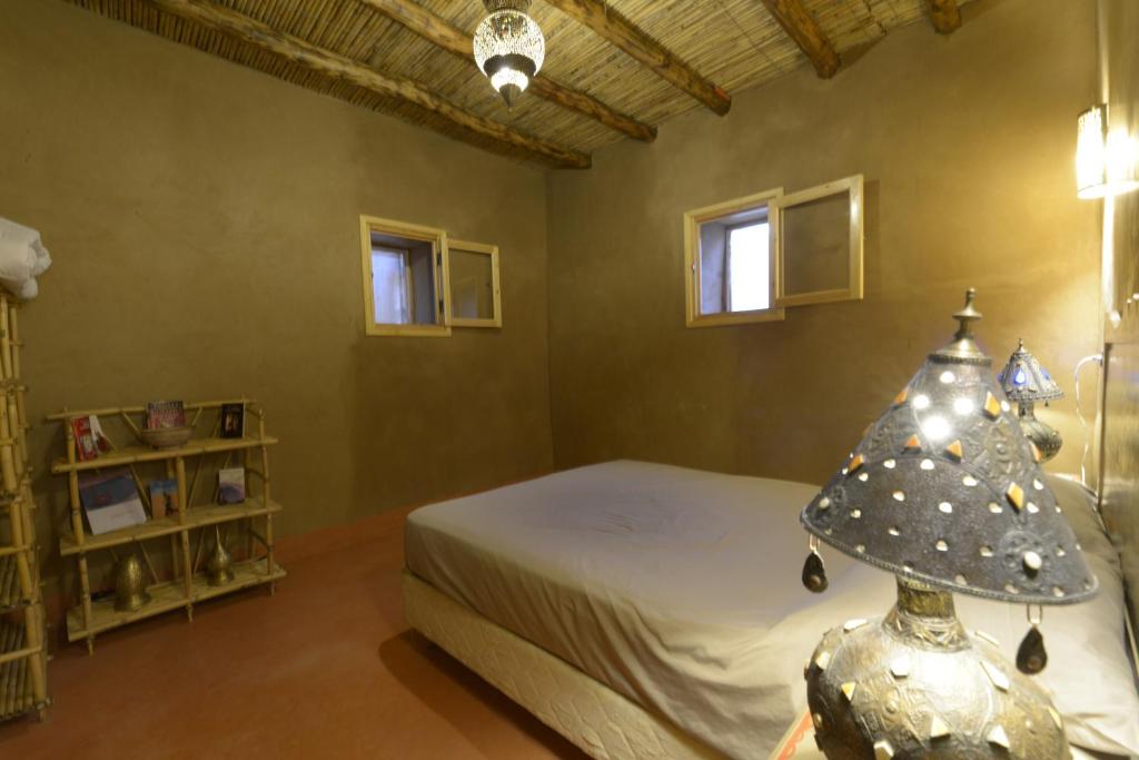 Postel nebo postele na pokoji v ubytování Guest farm Oulad Chmicha