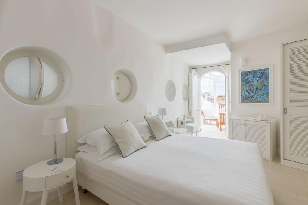 Posteľ alebo postele v izbe v ubytovaní Relais La Ghinghetta