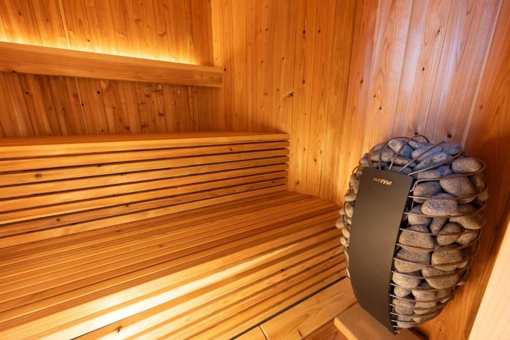 a sauna with a rock in the corner at Obaranchi - Vacation STAY 18154 in Kawasaki