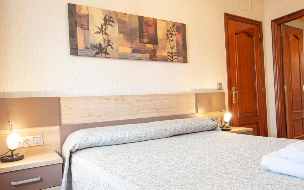 A bed or beds in a room at CASA RURAL BARAZAR