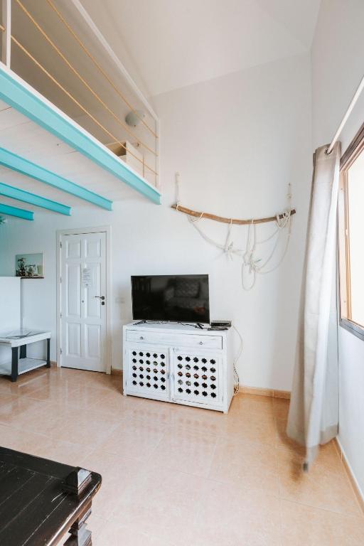 TV a/nebo společenská místnost v ubytování Casa Mimi vista piscina