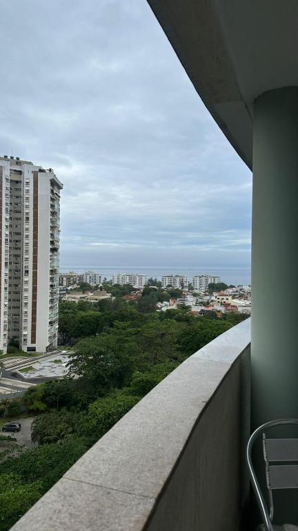 a view of a city from the balcony of a building at Mediterrâneo flat 1309 in Rio de Janeiro