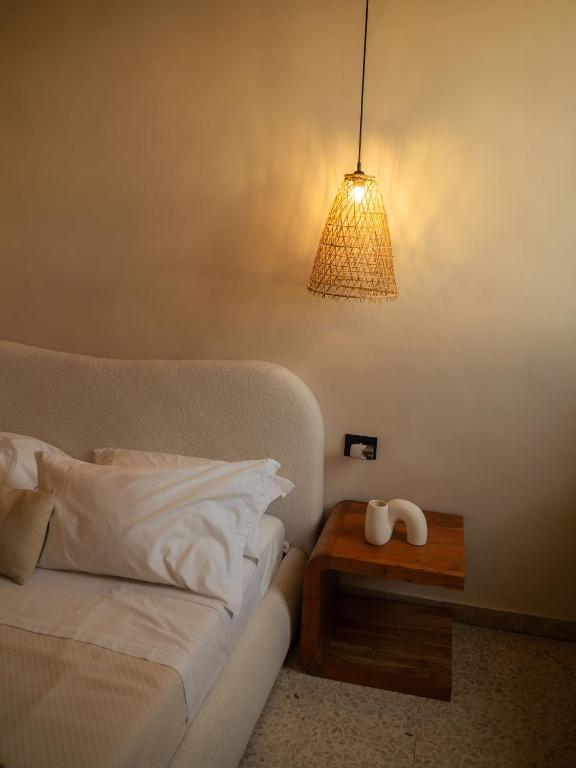 Postel nebo postele na pokoji v ubytování Taga Suites