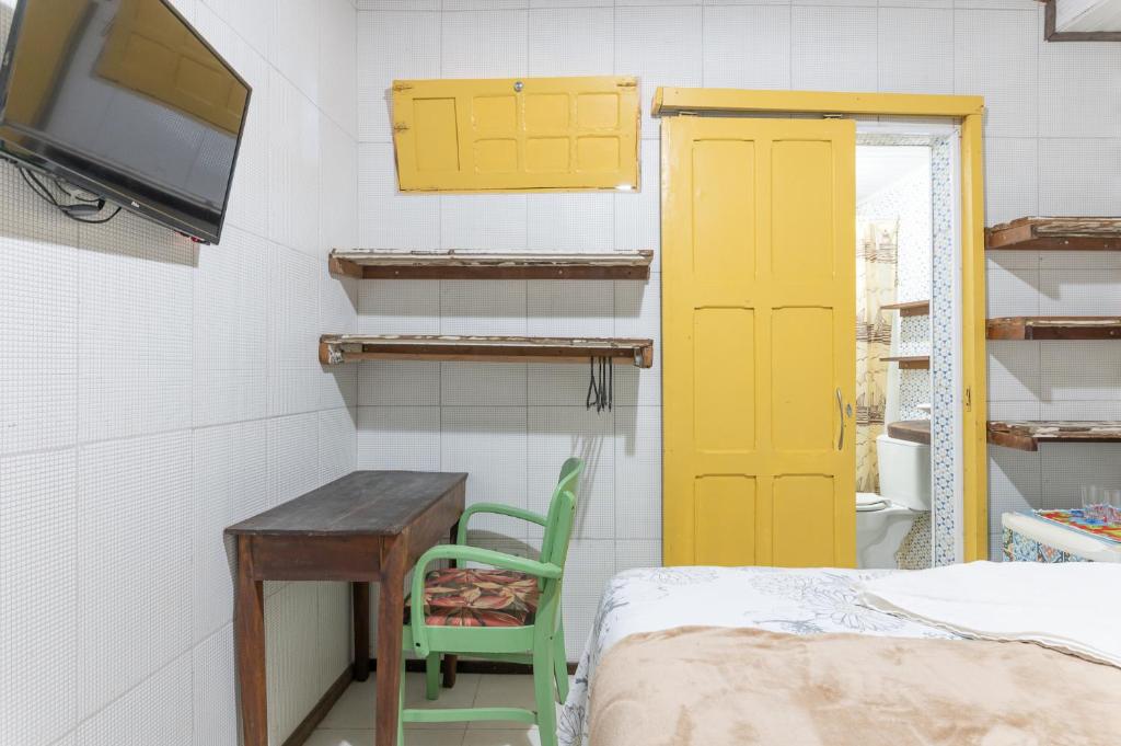 Uma TV ou centro de entretenimento em Pousada Flor de Olinda