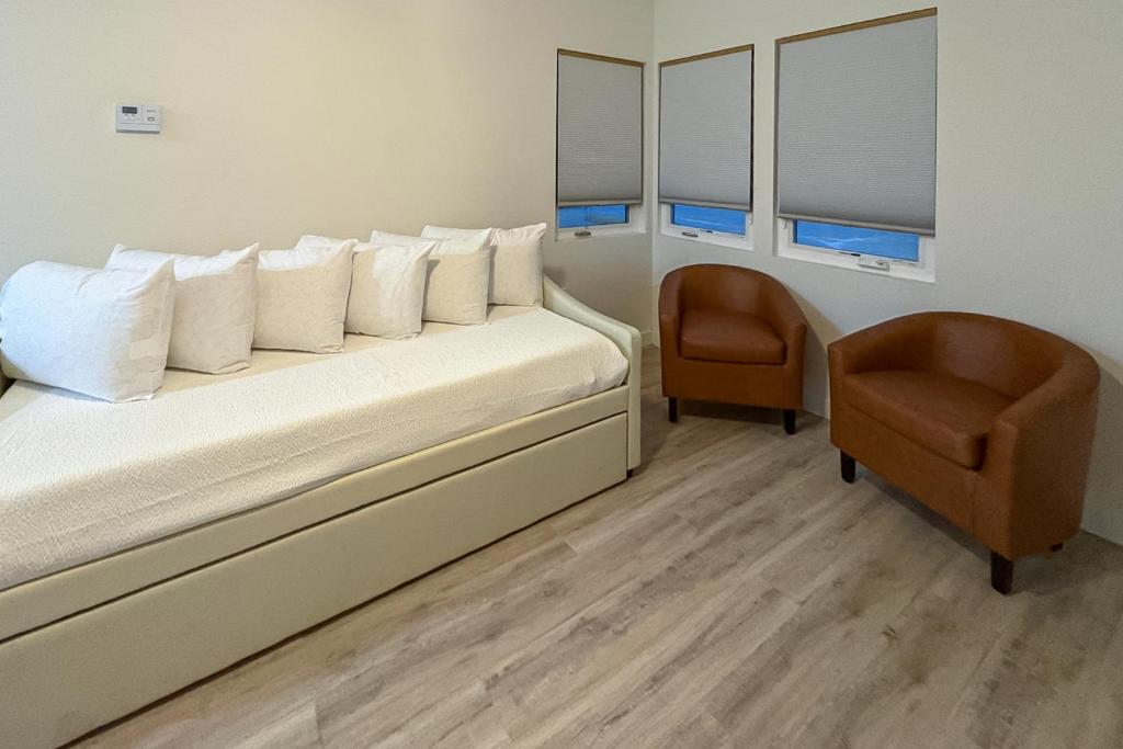 En eller flere senge i et værelse på The Beach Suite #3