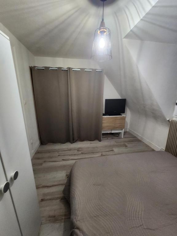 Postel nebo postele na pokoji v ubytování Gîte du logelbach