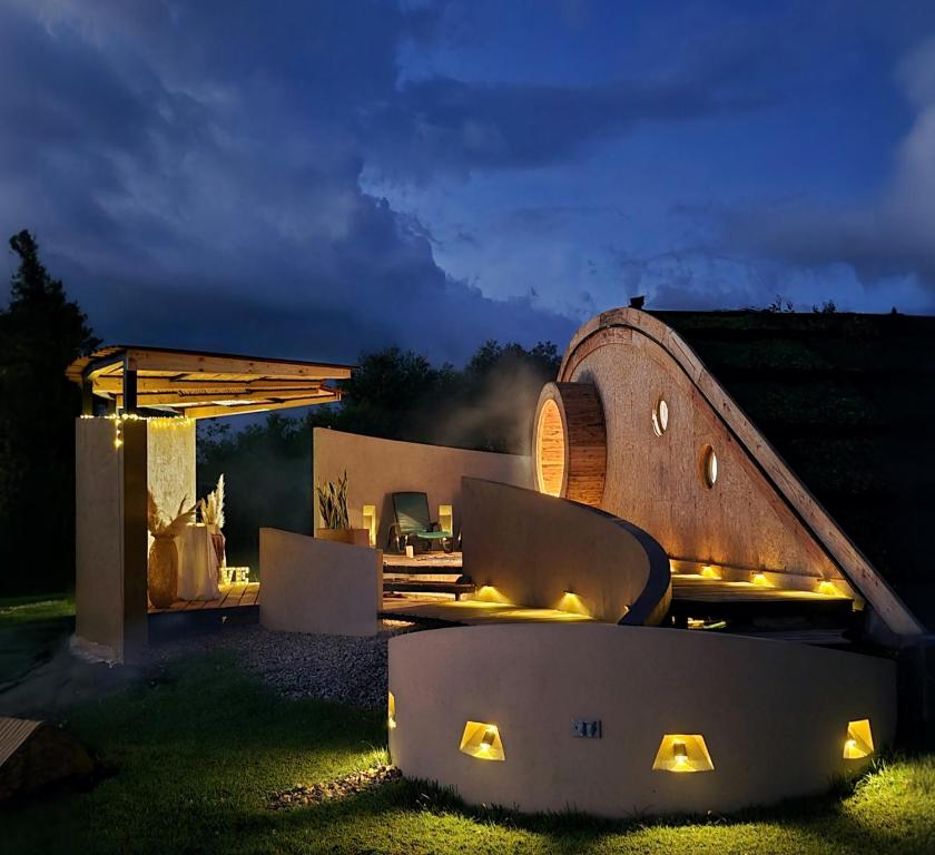 a night view of a house with a patio at Glampings Magic Bungalow in Villa de Leyva