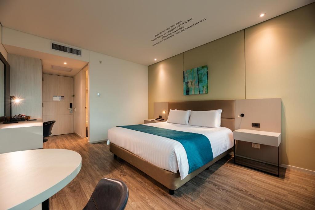 Postel nebo postele na pokoji v ubytování Hotel Estelar Square