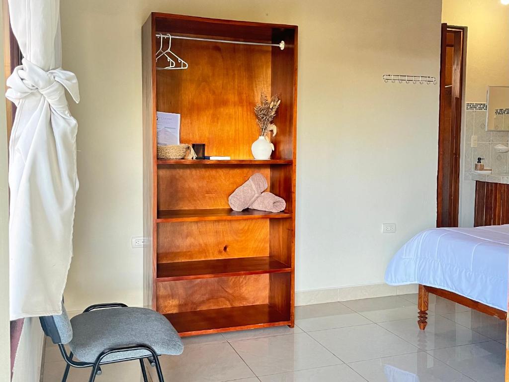 Postel nebo postele na pokoji v ubytování Los Tucanes Lodging