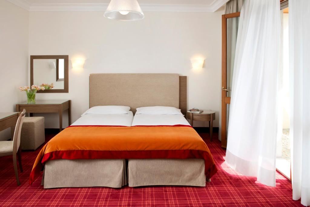 Postel nebo postele na pokoji v ubytování Hotel Apollo Terme