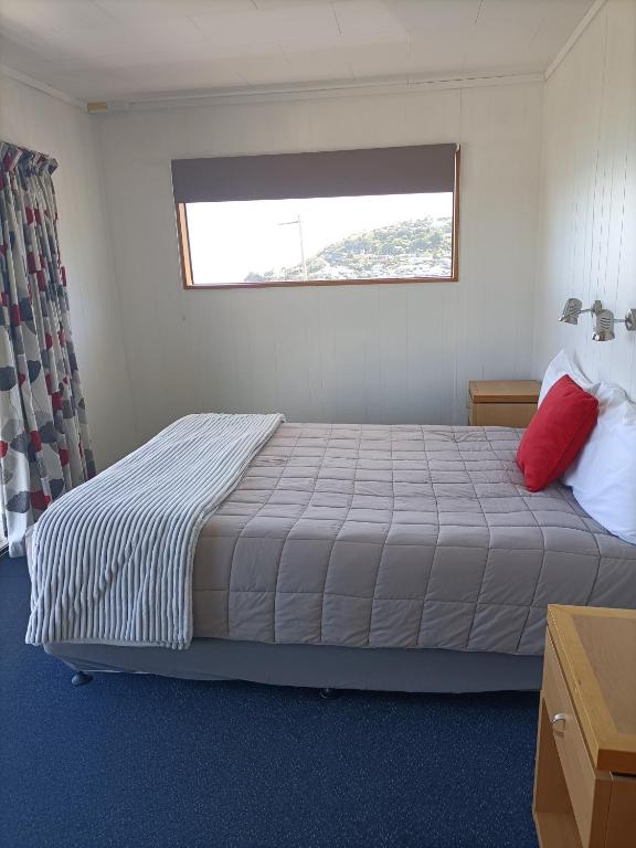 Postel nebo postele na pokoji v ubytování Moeraki Beach Motels
