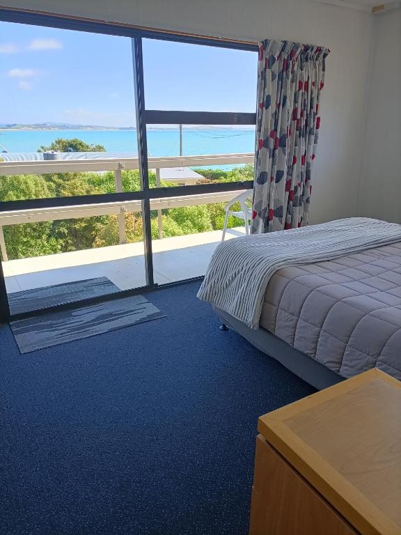 Postel nebo postele na pokoji v ubytování Moeraki Beach Motels