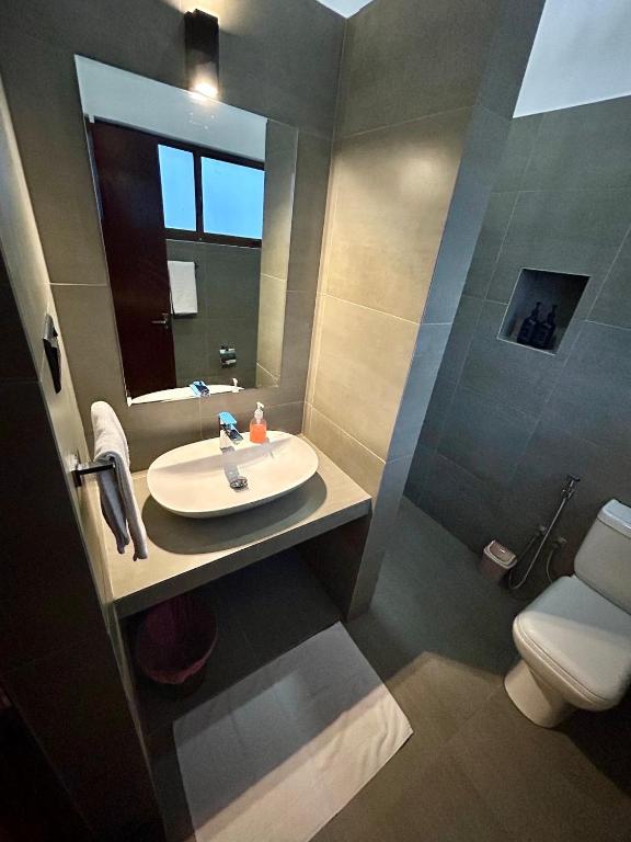 Koupelna v ubytování Reef Bungalow Hotel