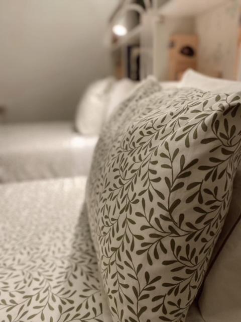 Uma cama ou camas num quarto em Hotel Lusitano