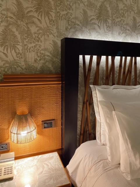 Uma cama ou camas num quarto em Hotel Lusitano