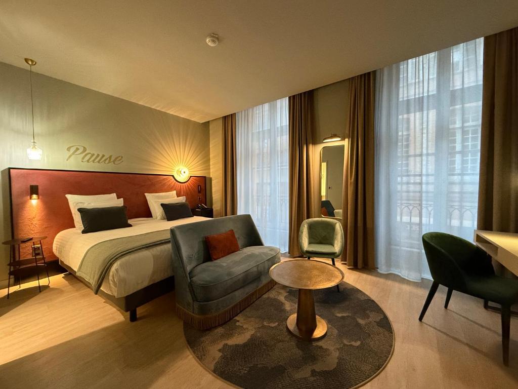 Postel nebo postele na pokoji v ubytování Hôtel Mercure Montauban