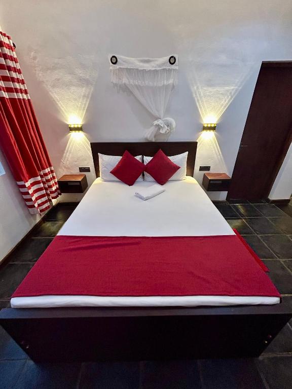 Postel nebo postele na pokoji v ubytování Reef Bungalow Hotel