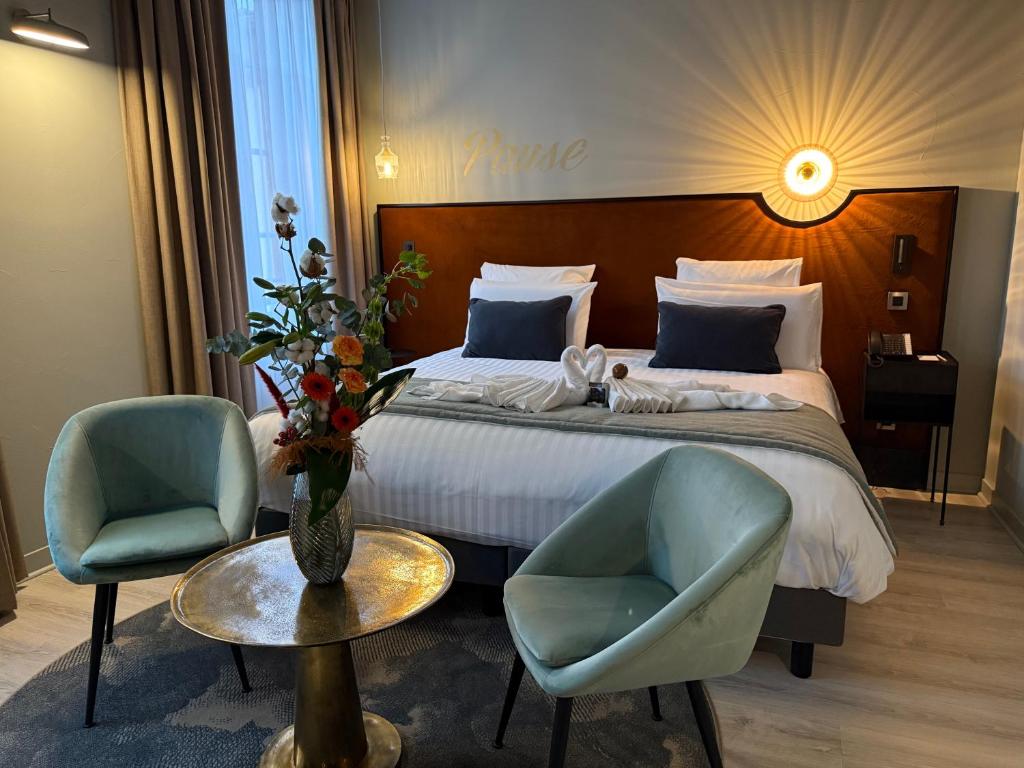 Postel nebo postele na pokoji v ubytování Hôtel Mercure Montauban
