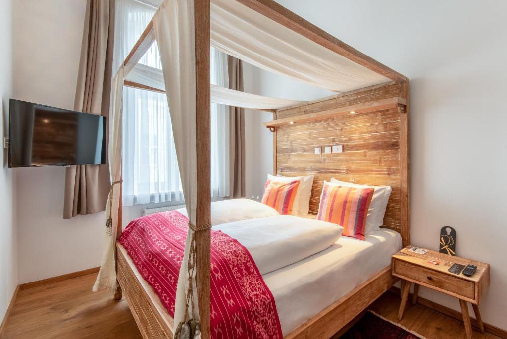 Postel nebo postele na pokoji v ubytování Lulu Guldsmeden