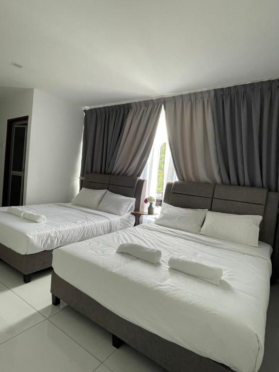 Postel nebo postele na pokoji v ubytování TDOZE Hotel