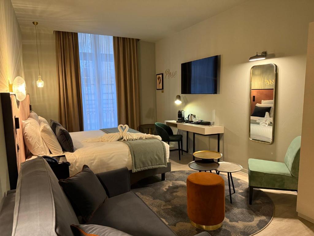 Postel nebo postele na pokoji v ubytování Hôtel Mercure Montauban
