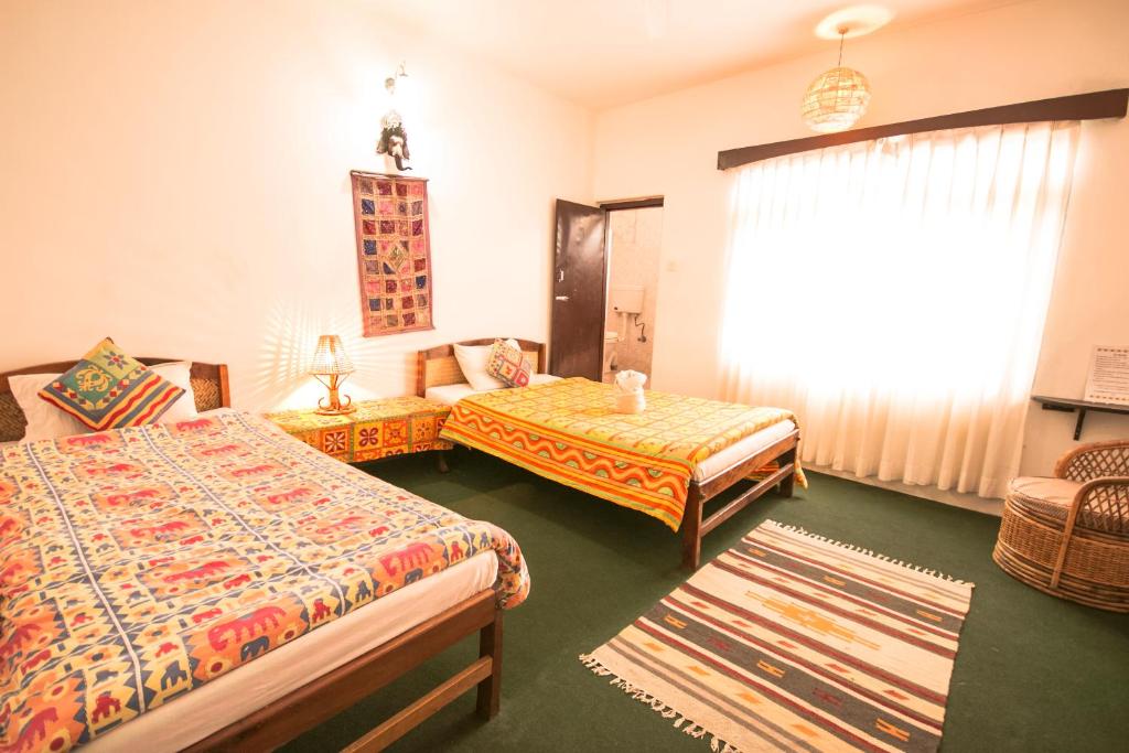 Letto o letti in una camera di Peace Eye Guest House
