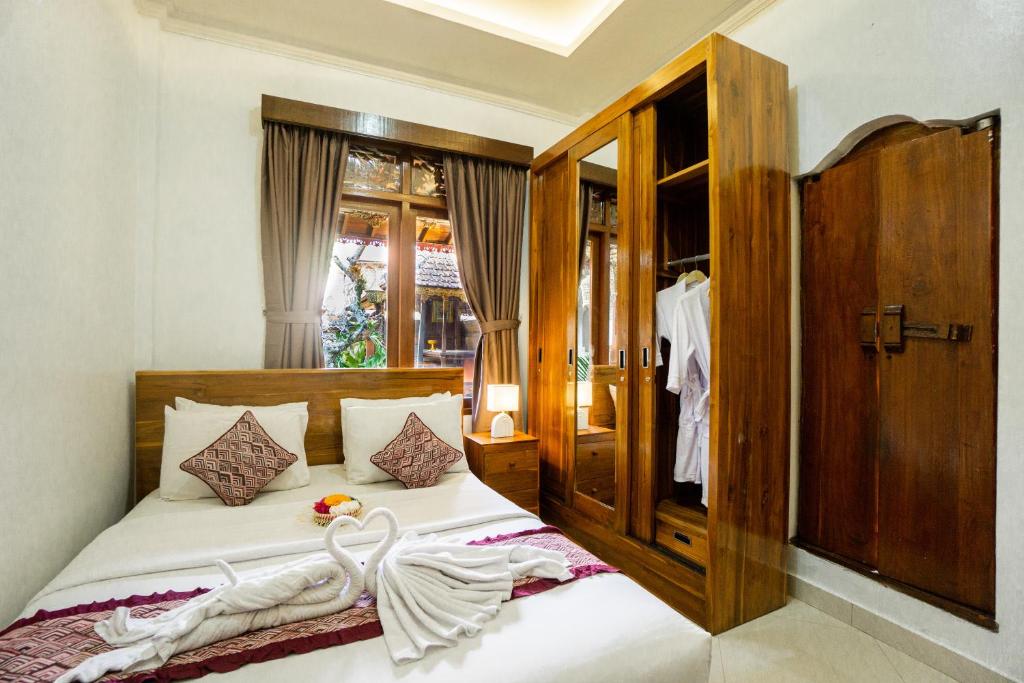 Postel nebo postele na pokoji v ubytování D'Ubud House