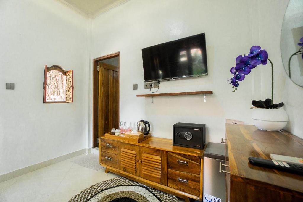 TV a/nebo společenská místnost v ubytování D'Ubud House