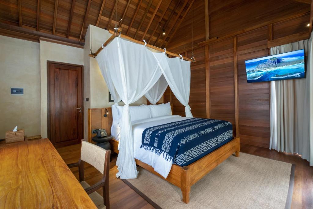 Postel nebo postele na pokoji v ubytování Samujha Ubud Resort