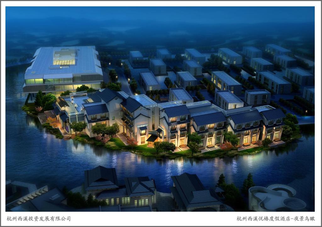 an aerial view of a building on an island in the water at Angsana Hangzhou in Hangzhou