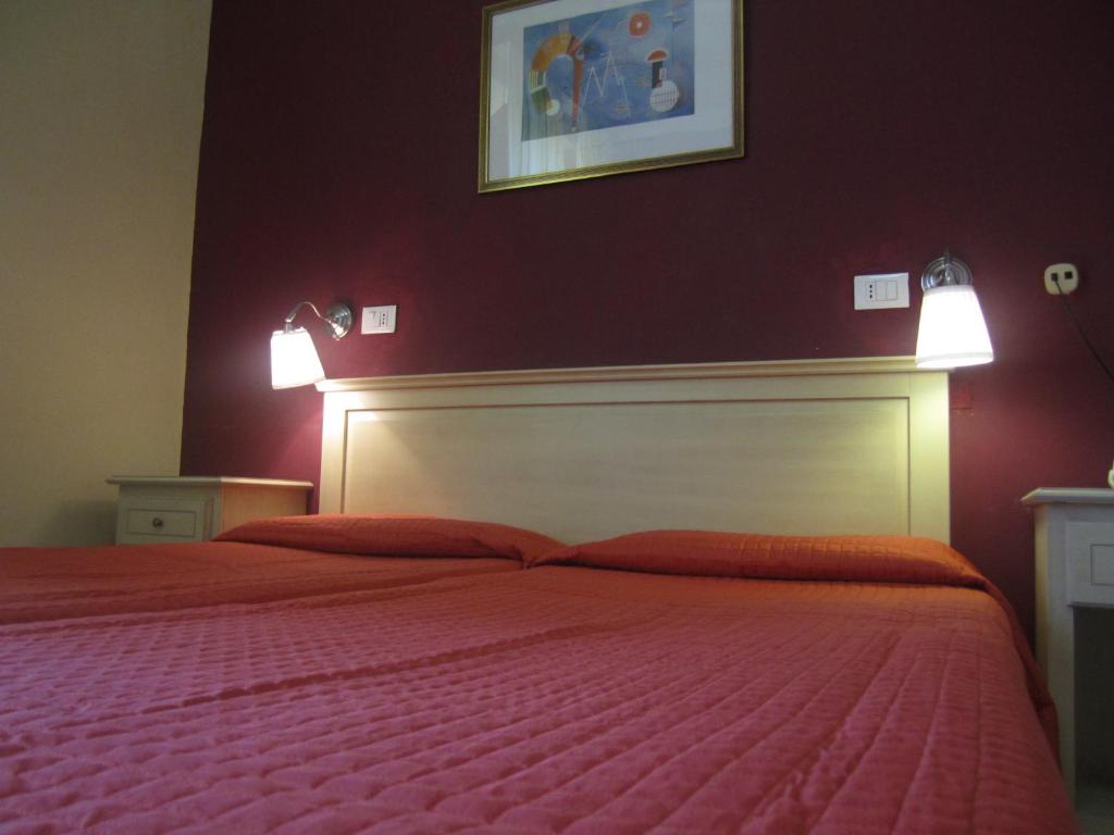 Postel nebo postele na pokoji v ubytování Hotel Genzianella