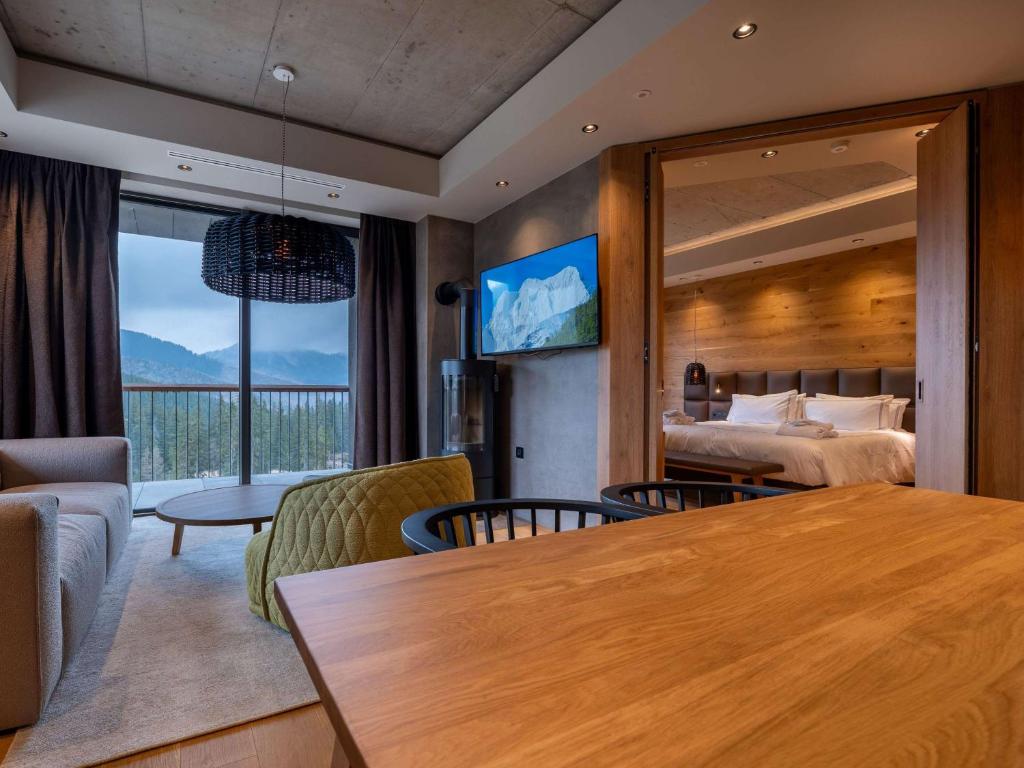 Postel nebo postele na pokoji v ubytování Swissôtel Damian Jasna