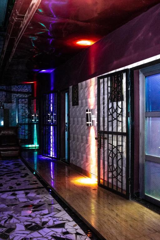 a room with stained glass windows and a dance floor at Luxuria Inn yaounde in Yaoundé