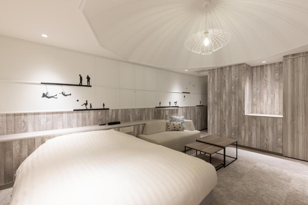 Postel nebo postele na pokoji v ubytování Hotel Foroot - Adult Only