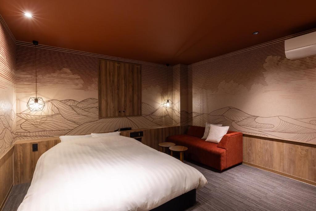 Postel nebo postele na pokoji v ubytování Hotel Foroot - Adult Only