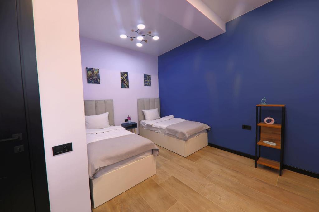 Postel nebo postele na pokoji v ubytování Gardeni Guest House