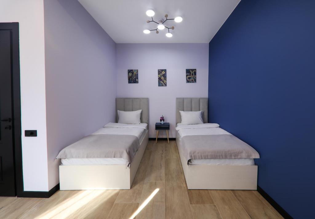 Postel nebo postele na pokoji v ubytování Gardeni Guest House