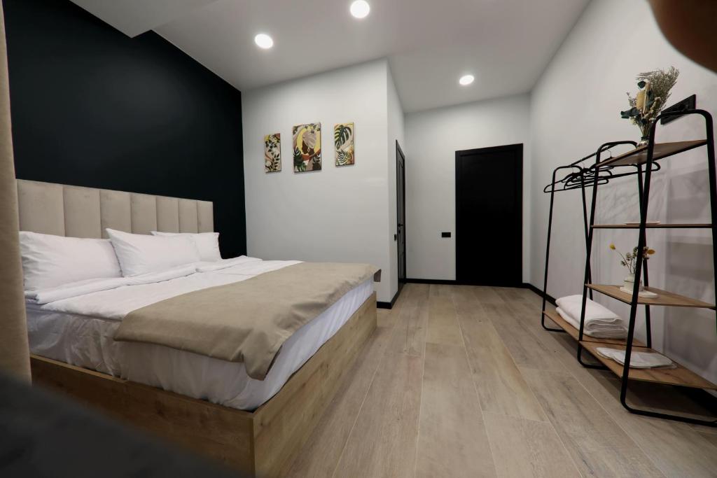 Postel nebo postele na pokoji v ubytování Gardeni Guest House