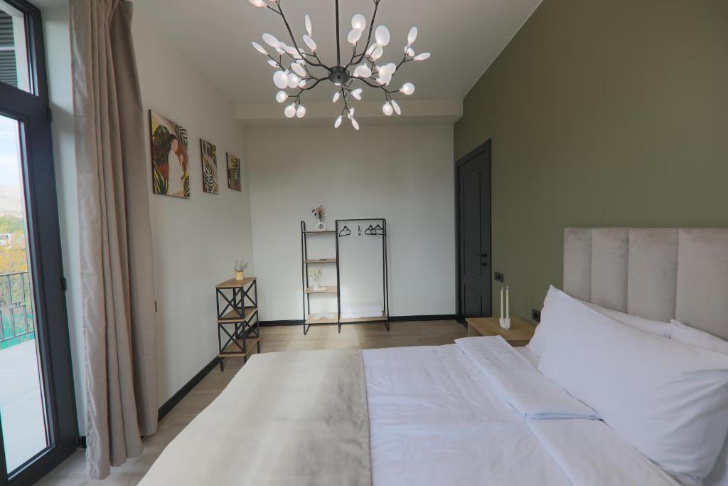 Postel nebo postele na pokoji v ubytování Gardeni Guest House