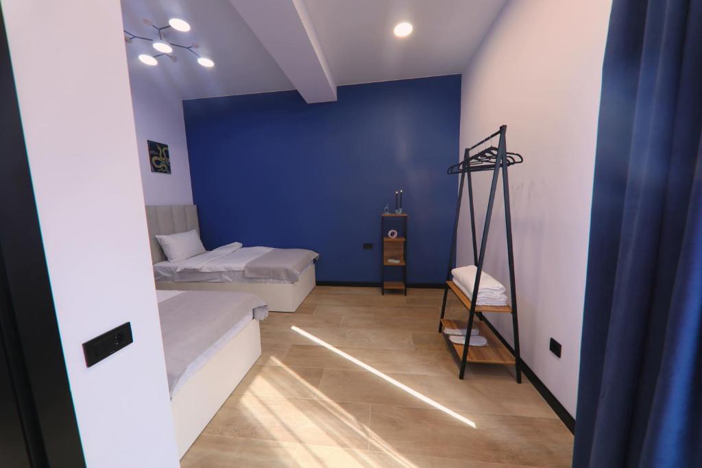 Postel nebo postele na pokoji v ubytování Gardeni Guest House