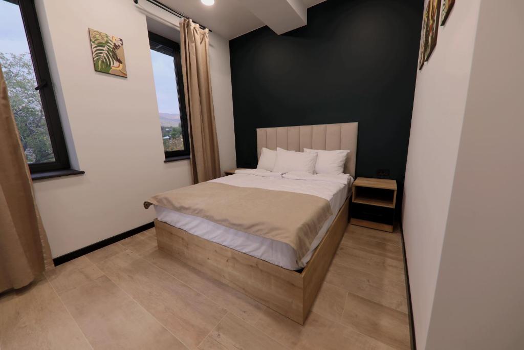 Postel nebo postele na pokoji v ubytování Gardeni Guest House