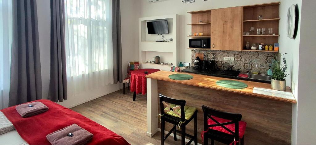 Televízia a/alebo spoločenská miestnosť v ubytovaní M37 Apartman