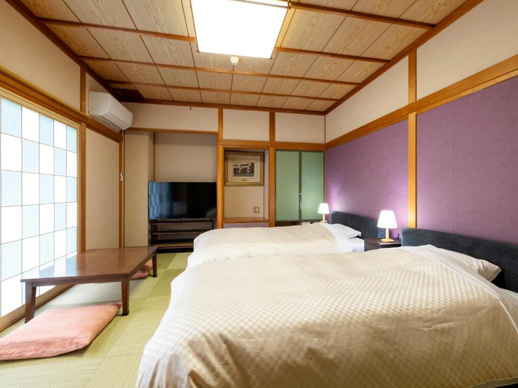 ホテルサンバレー伊豆長岡 本館にあるベッド