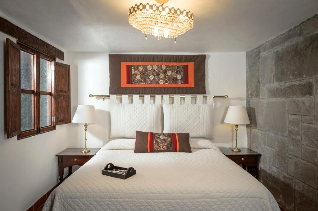 Postel nebo postele na pokoji v ubytování Hotel Tapalpa de Mis Amores