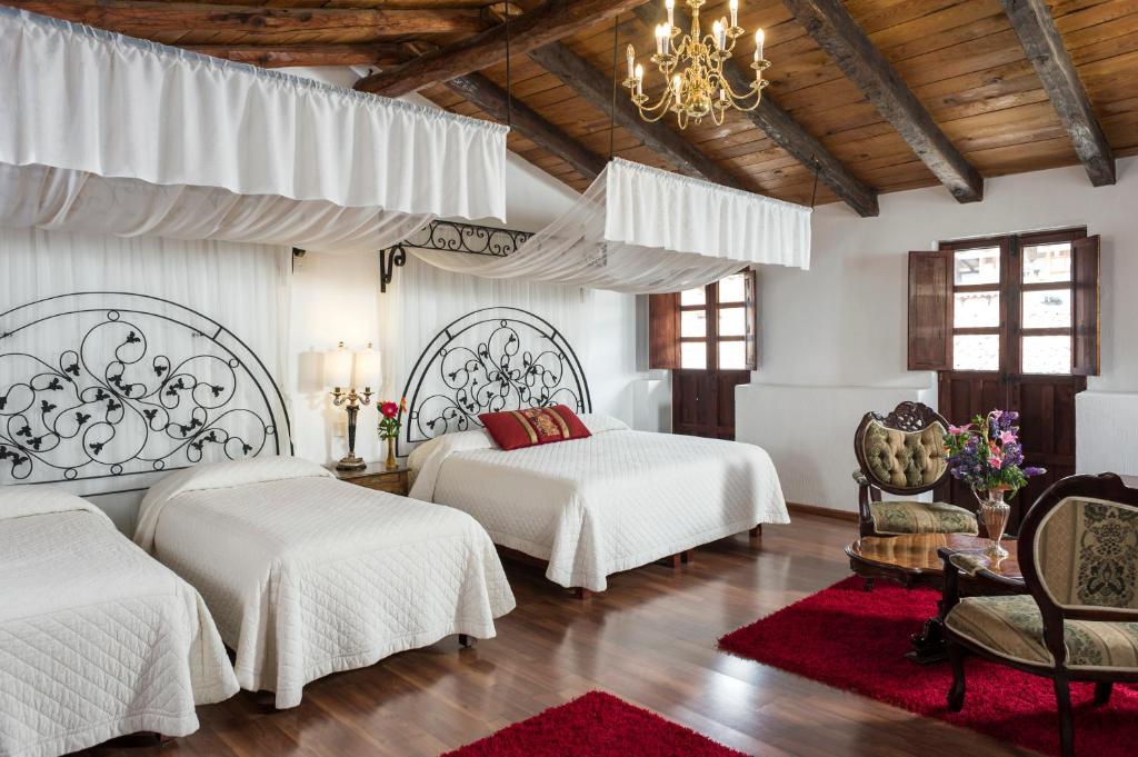 Postel nebo postele na pokoji v ubytování Hotel Tapalpa de Mis Amores