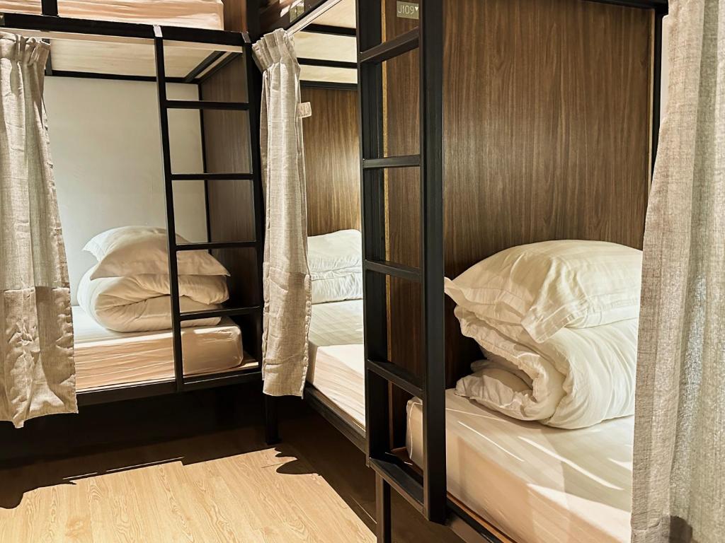 Postel nebo postele na pokoji v ubytování Jiran Hostel Kota Kinabalu