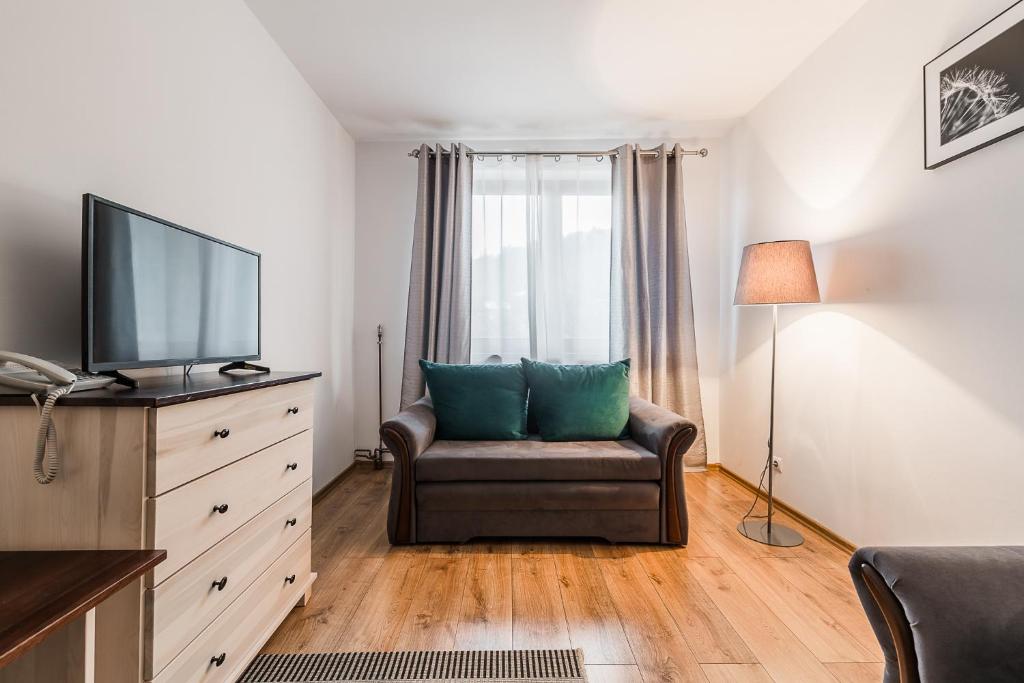 TV a/nebo společenská místnost v ubytování Wołosań B&B