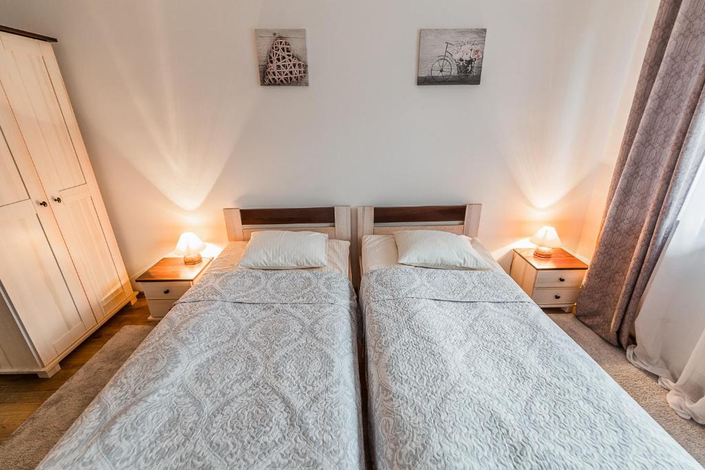 Postel nebo postele na pokoji v ubytování Wołosań B&B